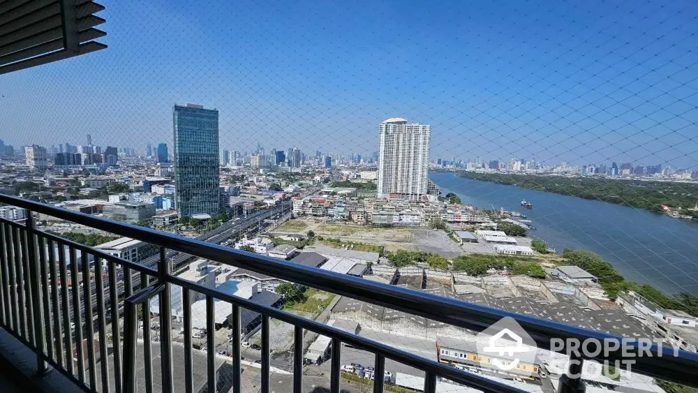 Stunning cityscape view from high-rise balcony overlooking river and skyline