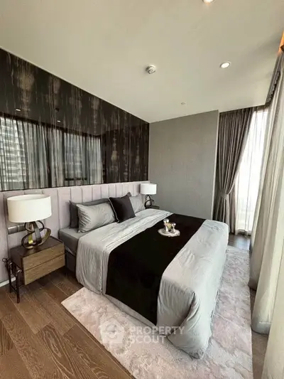 Luxurious modern bedroom with elegant decor and floor-to-ceiling windows.