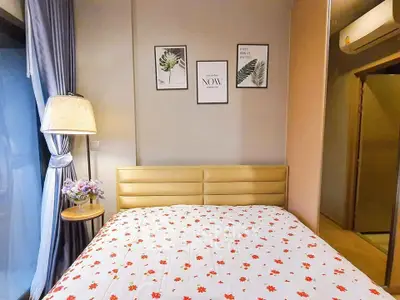 Cozy bedroom with floral bedding and stylish decor