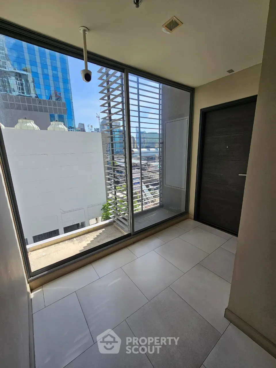 Modern building corridor with large windows and city view