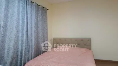 Cozy bedroom with elegant tufted headboard and stylish curtains