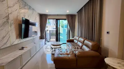 Luxurious living room with marble accents and leather sofa in modern apartment