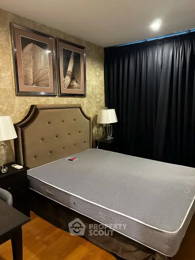 Luxurious bedroom with elegant decor and plush bed in a modern apartment.