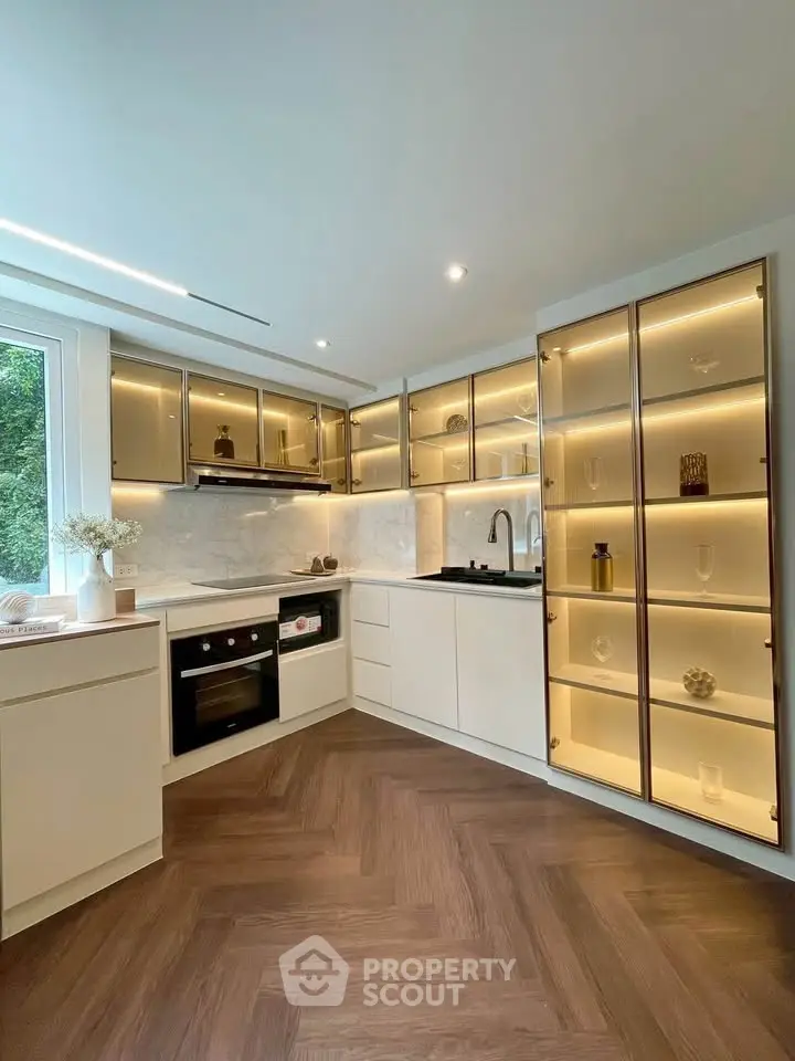 Modern kitchen with sleek cabinetry and integrated appliances
