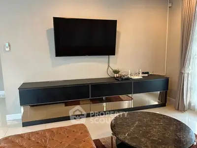 Modern living room with sleek TV setup and elegant furniture