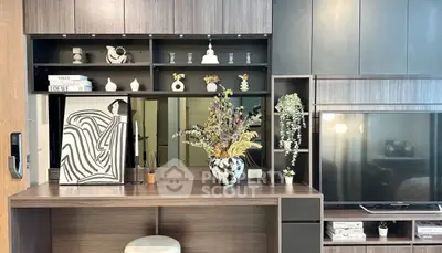 Modern living room with stylish shelving and large TV unit