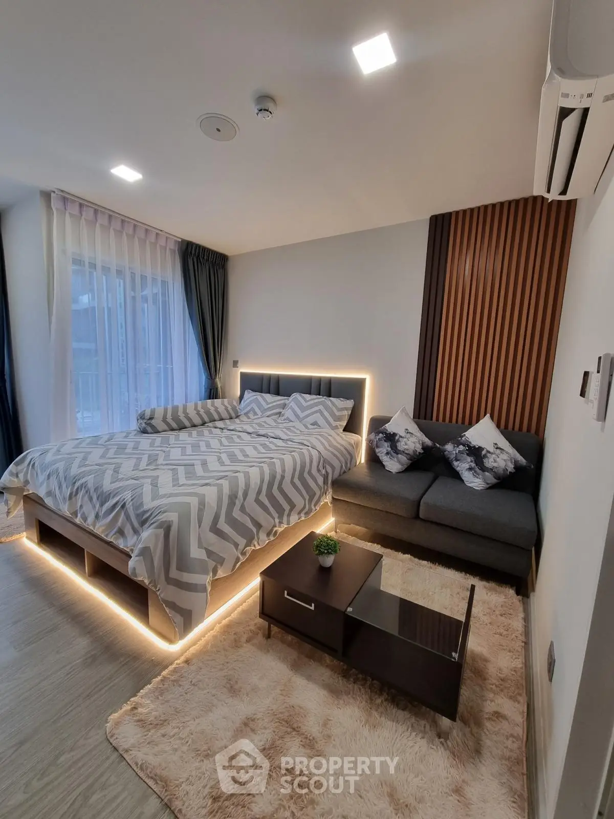 Modern bedroom with stylish lighting and cozy decor