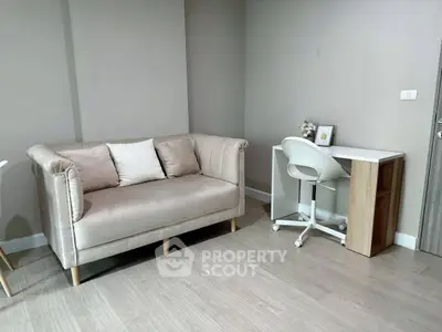 Modern living room with stylish sofa and compact study desk