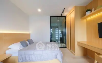 Modern bedroom with sleek wooden furnishings and ambient lighting