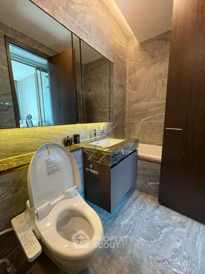 Luxurious modern bathroom with marble finishes and sleek fixtures