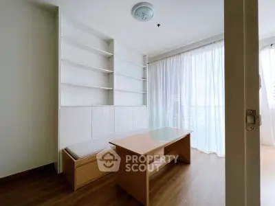 Bright study room with built-in shelves and natural light