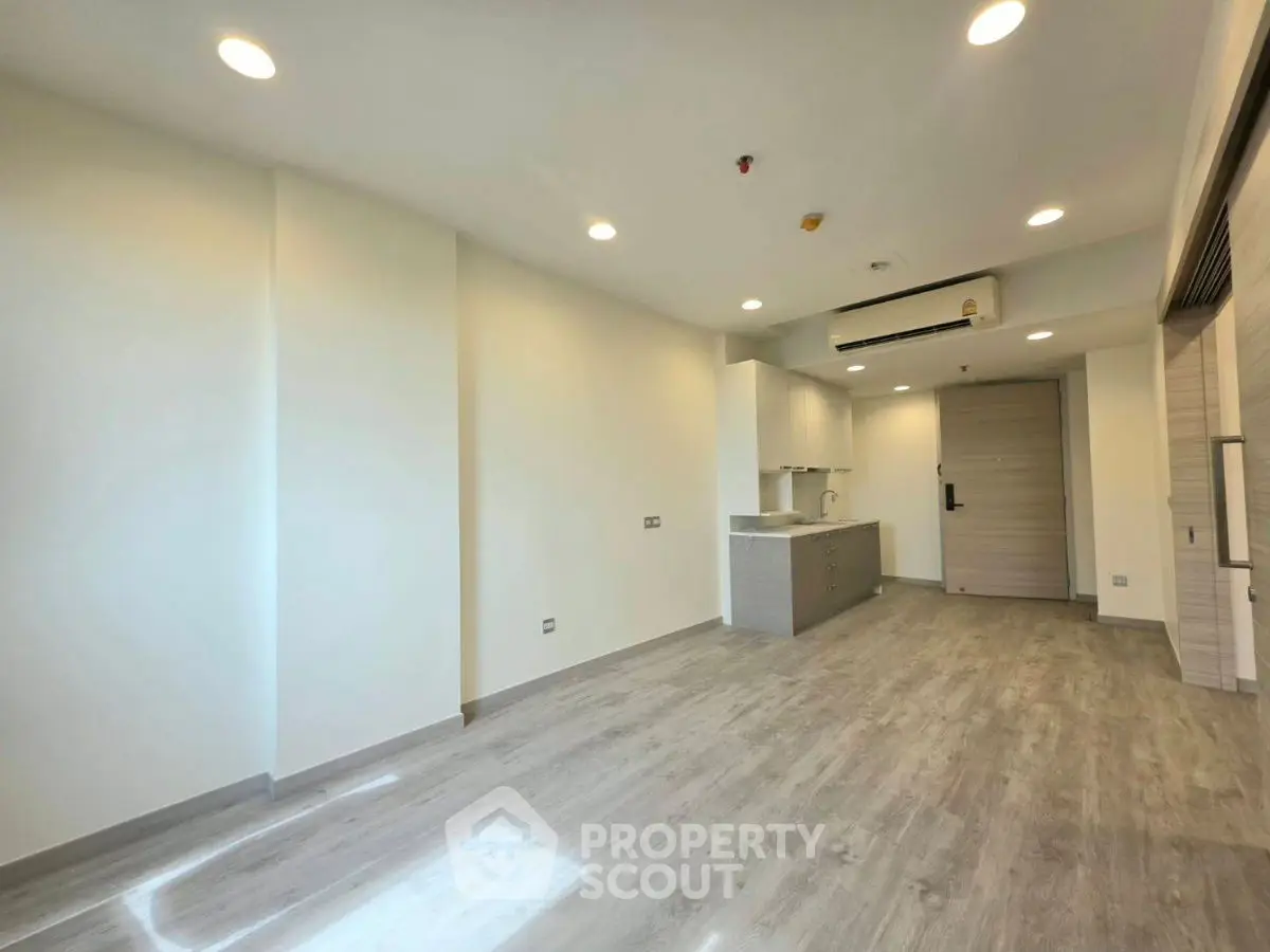 Modern minimalist apartment interior with open layout and sleek flooring