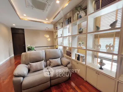 Luxurious living room with elegant shelving and plush seating in modern apartment