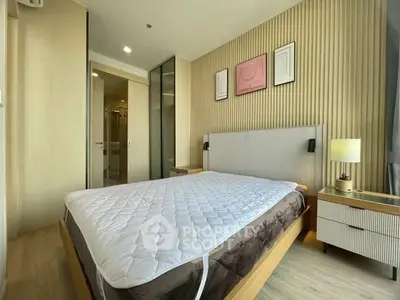 Modern bedroom with stylish decor and ample natural light in a contemporary apartment.