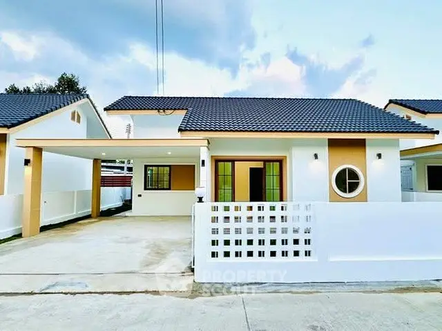 Charming single-story home with modern design and spacious driveway