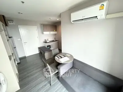 Modern apartment interior with sleek kitchen and cozy living area