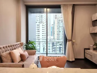 Modern living room with city view and stylish decor in high-rise apartment