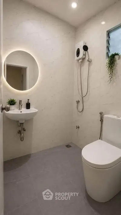 Modern bathroom with sleek fixtures and minimalist design, featuring a round mirror and wall-mounted shower.