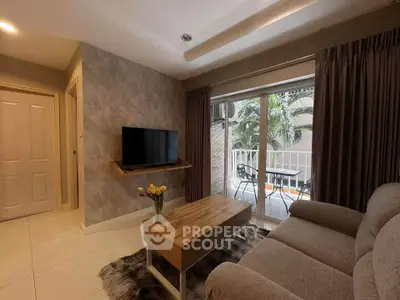 Cozy living room with modern decor and balcony access in a stylish apartment.