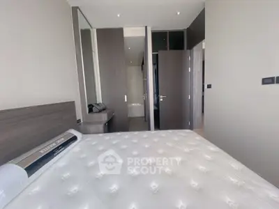 Modern bedroom with sleek design and ensuite bathroom