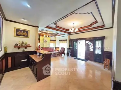 Spacious living room with elegant ceiling design and natural light