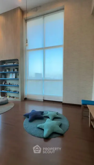 Spacious modern living room with large windows and stylish decor