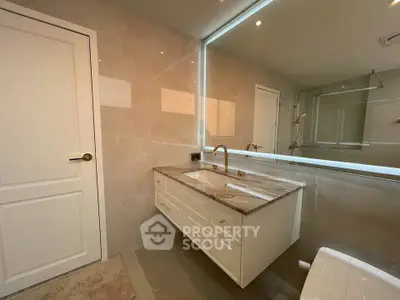 Luxurious bathroom with elegant vanity and large mirror