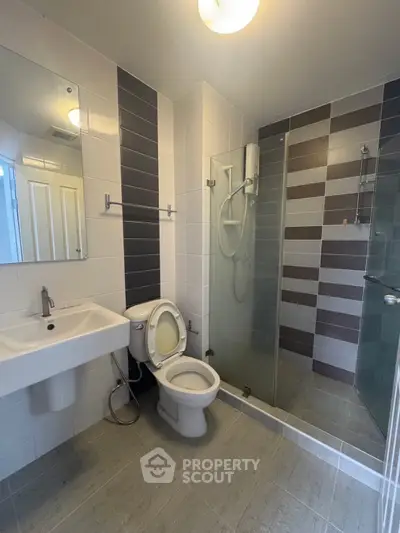 Modern bathroom with sleek shower and contemporary fixtures