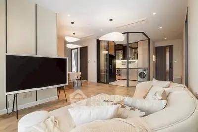 Modern living room with stylish decor and open kitchen layout