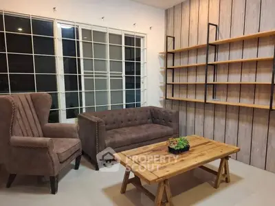 Stylish living room with modern furniture and large windows