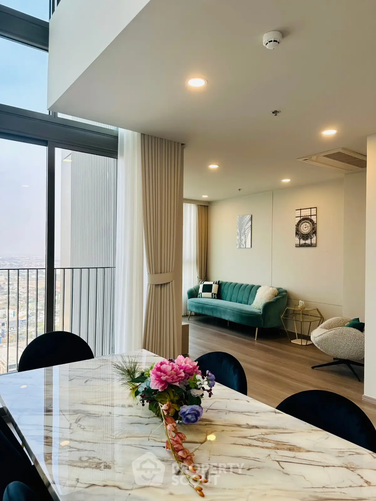 Luxurious high-rise living room with panoramic city views and elegant decor