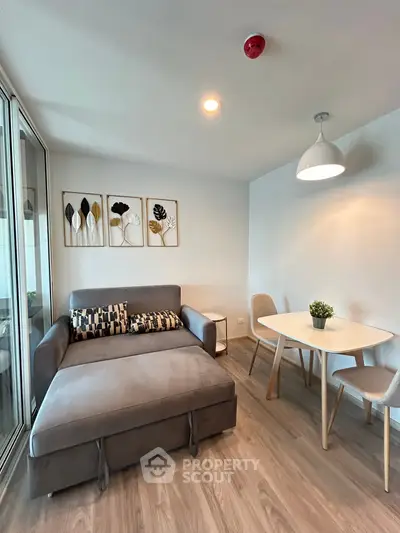 Modern living room with stylish decor and cozy seating area.