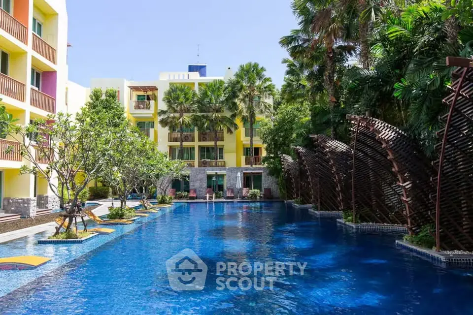 Luxurious resort-style pool with lush greenery and modern architecture