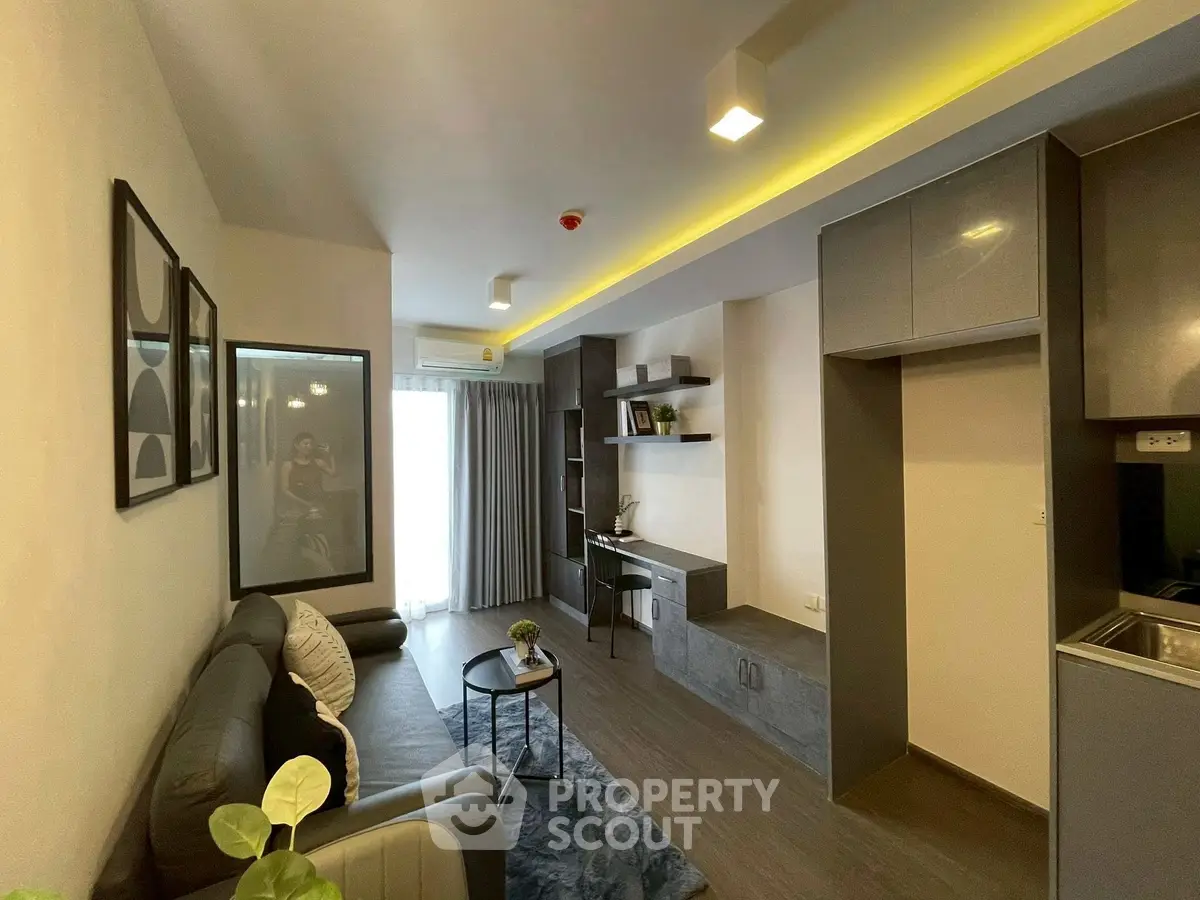 Modern living room with sleek design, cozy seating, and stylish decor in a contemporary apartment.