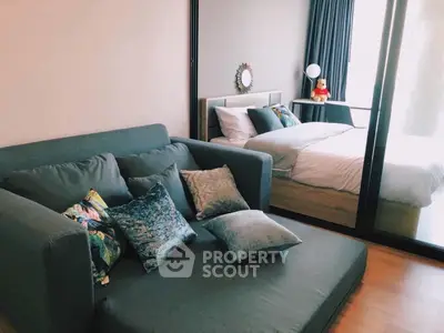 Cozy bedroom with stylish sofa and elegant decor, perfect for relaxation and comfort.