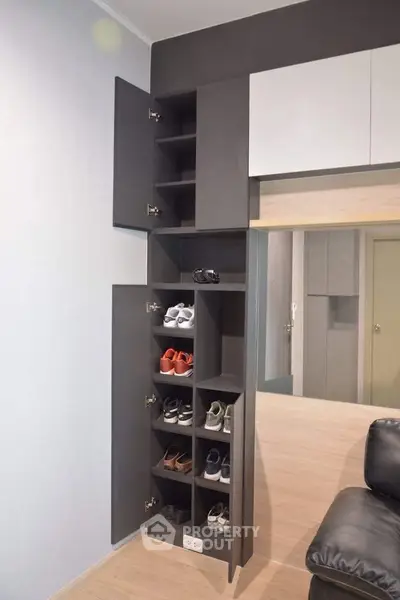 Modern shoe storage cabinet in stylish living room with sleek design