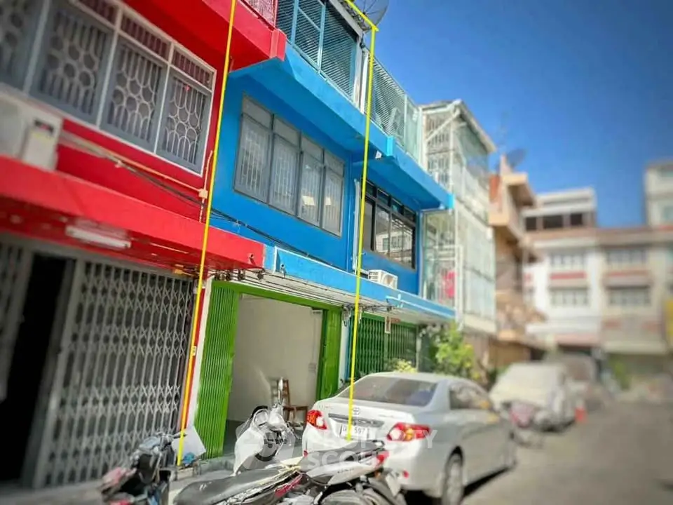 Vibrant urban building with colorful facade and street view