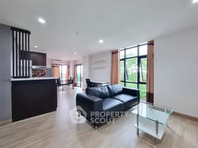 Spacious modern living room with open layout and large windows