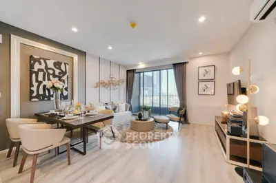 Modern living room with elegant decor and large windows offering a stunning view.