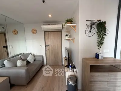 Modern living room with stylish decor and cozy seating in a contemporary apartment.