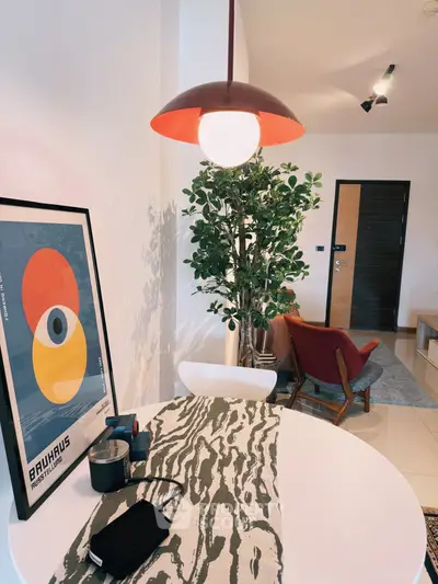 Stylish modern living room with unique decor and vibrant lighting