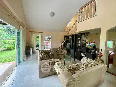 Spacious living room with garden view and elegant decor in modern home