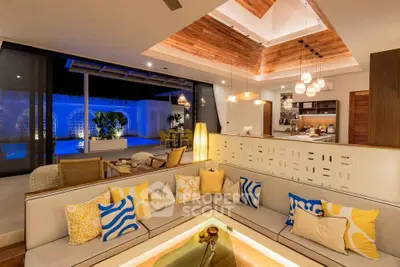 Luxurious open-plan living room with modern decor and pool view, perfect for entertaining.