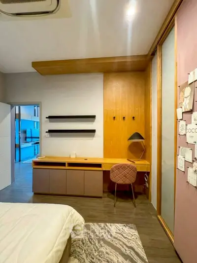 Modern bedroom with stylish desk and cozy decor