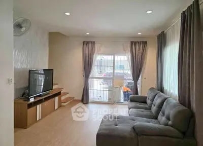 Spacious living room with modern decor and natural light