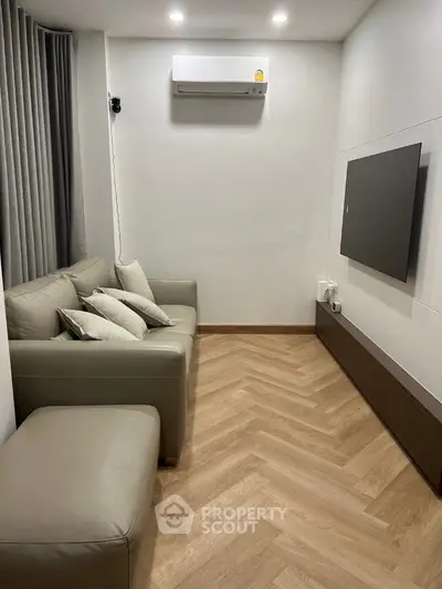 Modern living room with sleek design and air conditioning