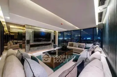 Luxurious modern living room with panoramic city view and elegant decor.