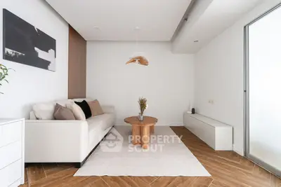 Modern living room with stylish decor and wooden flooring