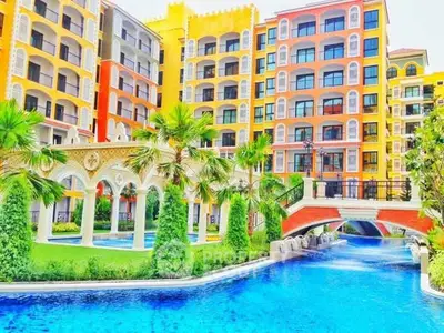 Luxurious resort-style apartment complex with vibrant architecture and stunning pool area.