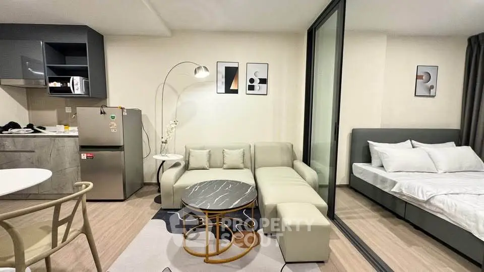 Modern studio apartment with open kitchen and cozy living area